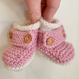 Baby booties with wooden buttons