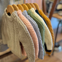 Hand-knitted cable jumper