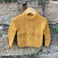 Hand-knitted cable jumper