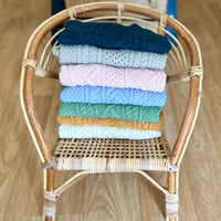 Hand-knitted cable jumper
