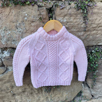 Hand-knitted cable jumper
