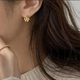 Bow huggie earrings by Greenwood Designs