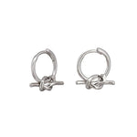 Silver knot huggie earrings by Tiger Tree