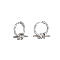 Silver knot huggie earrings by Tiger Tree
