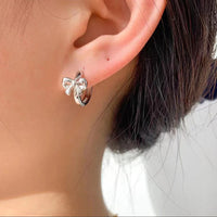 Bow huggie earrings by Greenwood Designs