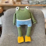 Crochet frog in board shorts by The Crocheting Constable